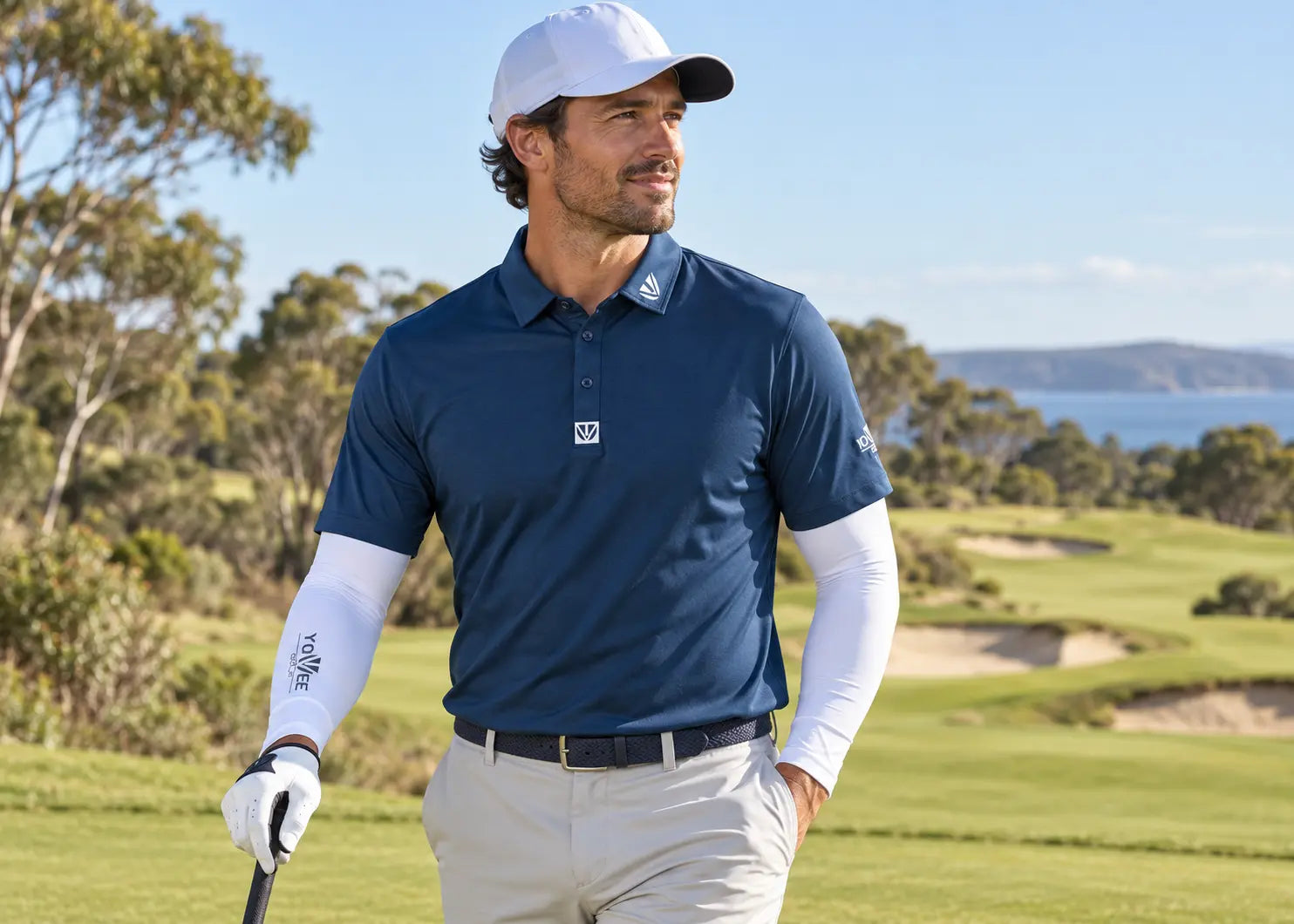 Man golfer wearing a YOUVEE polo